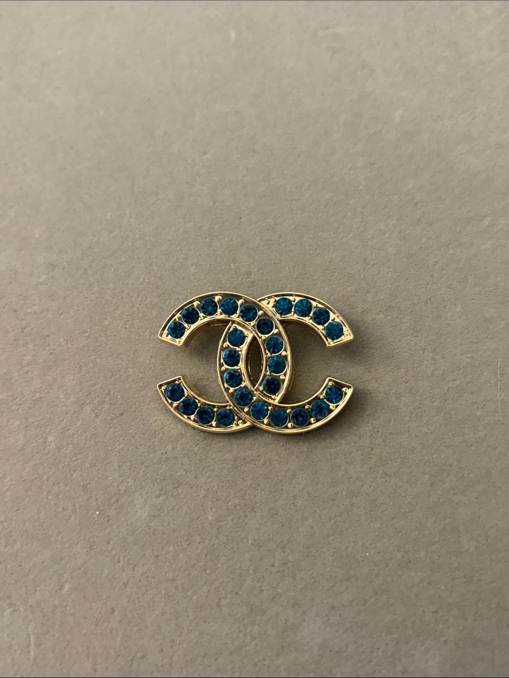 Gold-Tone Logo Brooch with Blue/ Turquoise Crystal Accents